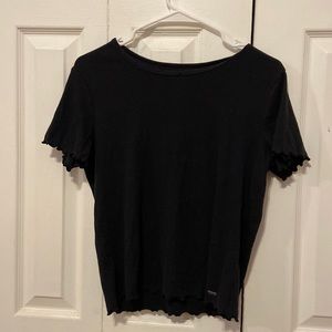 black hollister tee with ruffles. lightly warn